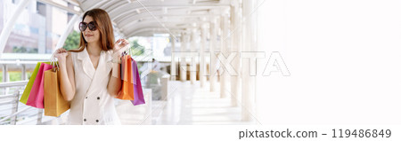 Banner Shopping bags of women crazy shopaholic person at fashion mall. Web Banner Woman love online shopping website holding shopping bags in hands with copy space. digital marketing happy lifestyle Banner Shopping bags of women crazy shopaholic person at fashion mall. Web Banner Woman love online shopping website holding shopping bags in hands with copy space. digital marketing happy lifestyle 119486849