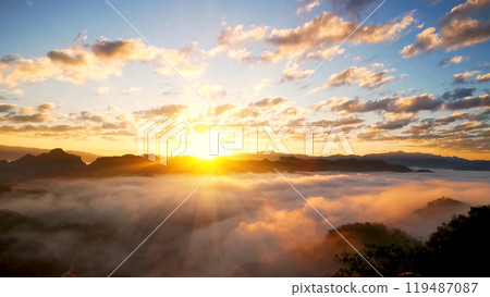 Scenic view dramatic beautiful sunset sky. Natural Sunset Sunrise on meadow silhouette shadow dark land. Vibrant dramatic sky on sunset, dawn, sunrise in Countryside. Landscape Colorful Sky At Sunset 119487087