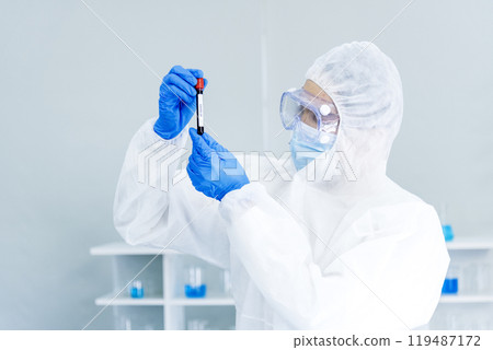 Scientist man holding sample blood test tube in science laboratory. Doctor clinic healthcare technician lab testing blood sample diagnosis. Asian man scientist working in hiv testing medical lab. Scientist man holding sample blood test tube in science laboratory. Doctor clinic healthcare technician lab testing blood sample diagnosis. Asian man scientist working in hiv testing medical lab. 119487172