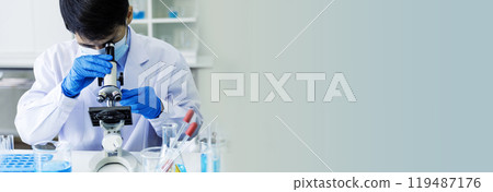 Banner Scientist man look Microscope research in science laboratory. Banner Asian scientist use microbiology microscope in laboratory equipment chemistry lab. Biochemistry experiment with copy space Banner Scientist man look Microscope research in science laboratory. Banner Asian scientist use microbiology microscope in laboratory equipment chemistry lab. Biochemistry experiment with copy space 119487176