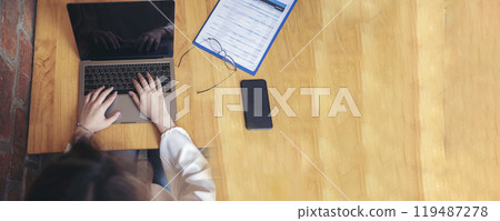 Banner Woman typing laptop computer online meeting at home office work from home. Asian businesswoman use notebook laptop. Programmer woman typing keyboard laptop read online website with copy space 119487278