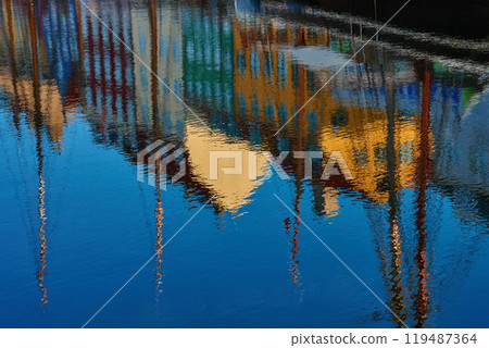 Nyhavn canal with colorful houses and moored boats in Copenhagen, Denmark at sunrise Nyhavn canal with colorful houses and moored boats in Copenhagen, Denmark at sunrise 119487364