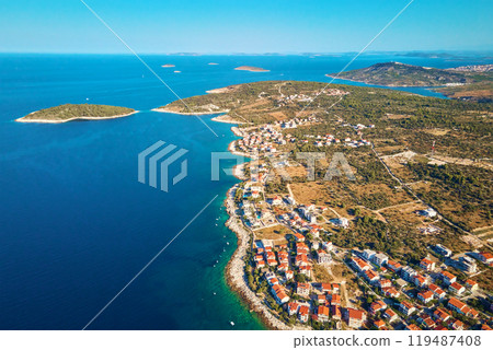 Aerial view of Adriatic sea coastline with coastal village and boats along shoreline. Panorama of tourist town Rogoznica in Croatia on Adriatic Sea. Summer travel concept 119487408