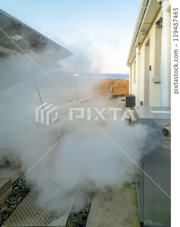 Steaming central heating boiler outside house in Ireland Steaming central heating boiler outside house in Ireland 119487465