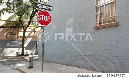 New York City oneway crossroad, Minetta street intersection, one way, red stop road sign. Manhattan. New York City oneway crossroad, Minetta street intersection, one way, red stop road sign. Manhattan. 119487871