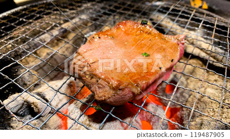 Juicy charcoal grilled beef fillet 119487905