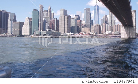 New York City downtown skyline from ferry boat. Manhattan bridge, East river, World Trade Center USA New York City downtown skyline from ferry boat. Manhattan bridge, East river, World Trade Center USA 119487941