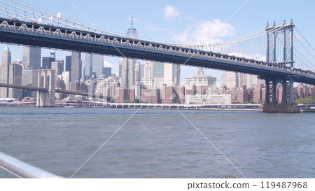 New York City downtown skyline from ferry boat. Manhattan bridge, East river, World Trade Center USA 119487968