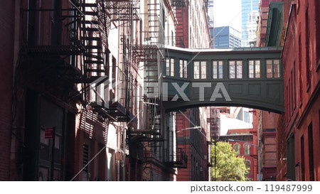 New York City Staple street skybridge. Industrial architecture, red brick building. Manhattan, USA. New York City Staple street skybridge. Industrial architecture, red brick building. Manhattan, USA. 119487999
