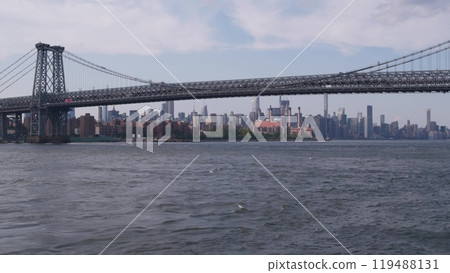 New York City skyline from ferry boat. Manhattan midtown, East river, Williamsburg Bridge, USA. New York City skyline from ferry boat. Manhattan midtown, East river, Williamsburg Bridge, USA. 119488131