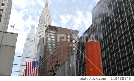 Steam vapor vented, New York City street steam system, orange vapour tube stack. Hot smoke from pipe Steam vapor vented, New York City street steam system, orange vapour tube stack. Hot smoke from pipe 119488146