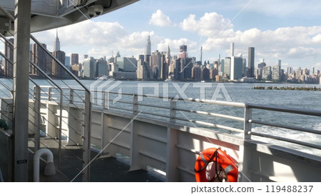New York City skyline from ferry boat. Manhattan midtown, Empire State, Chrysler Building, USA. New York City skyline from ferry boat. Manhattan midtown, Empire State, Chrysler Building, USA. 119488237