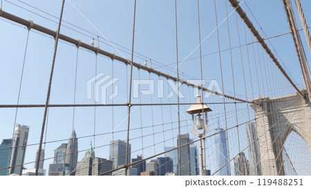 Brooklyn Bridge cables, Manhattan downtown. New York City skyline, financial district cityscape. 119488251