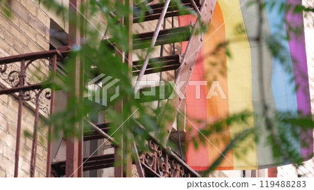 New York City building Manhattan USA. Residential house. LGBT rainbow flag, homosexual symbol. Pride 119488283