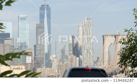 Cars on Brooklyn Bridge. New York City Manhattan skyline, downtown cityscape. World Trade Center. Cars on Brooklyn Bridge. New York City Manhattan skyline, downtown cityscape. World Trade Center. 119488287