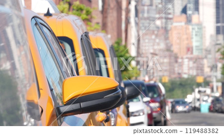 New York City. Row of yellow Taxi cars on street, Queens. Taxi cabs, Long Island. Medallion taxicab. New York City. Row of yellow Taxi cars on street, Queens. Taxi cabs, Long Island. Medallion taxicab. 119488382