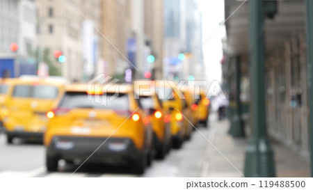 Row of yellow taxi cars, New York City Manhattan street. Defocused taxi cabs, medallion taxicab, USA 119488500