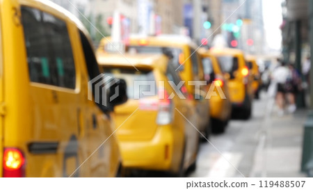 Row of yellow taxi cars, New York City Manhattan street. Defocused taxi cabs, medallion taxicab, USA 119488507