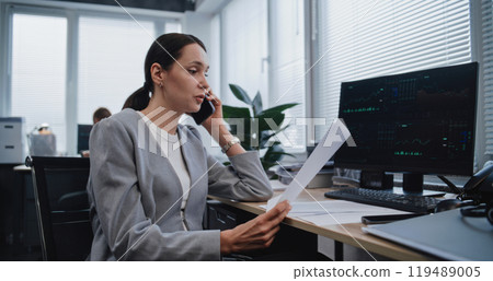 Female financial analyst discusses strategy of project using mobile phone Female financial analyst discusses strategy of project using mobile phone 119489005