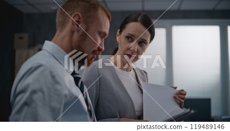Successful marketing professionals analyze documents, brainstorm business strategy Successful marketing professionals analyze documents, brainstorm business strategy 119489146