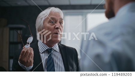 Angry boss loses temper, yells at male company employee 119489203