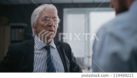 Angry boss loses temper, yells at male company employee 119489221