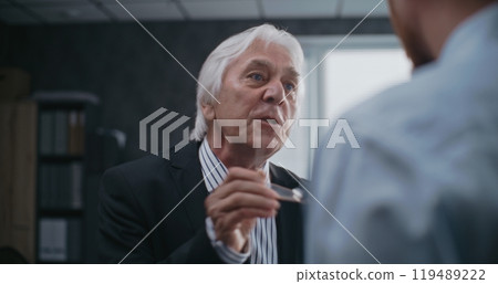 Angry boss loses temper, yells at male company employee 119489222