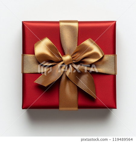 A beautifully wrapped red gift box with a gold ribbon and bow on a neutral background 119489564