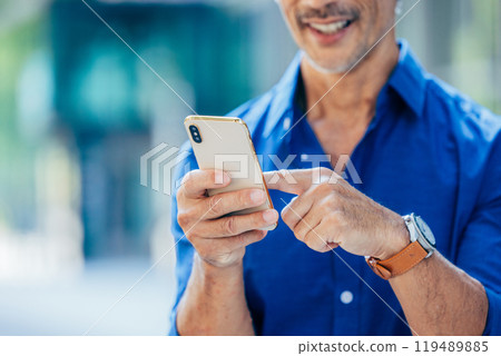 senior man with smartphone 119489885