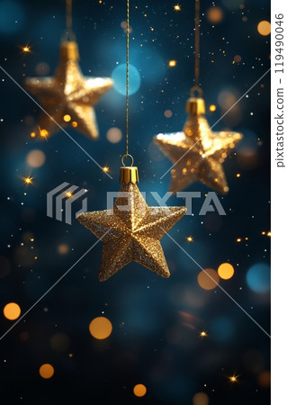 Golden star ornaments against a blurred background of blue and gold festive lights 119490046