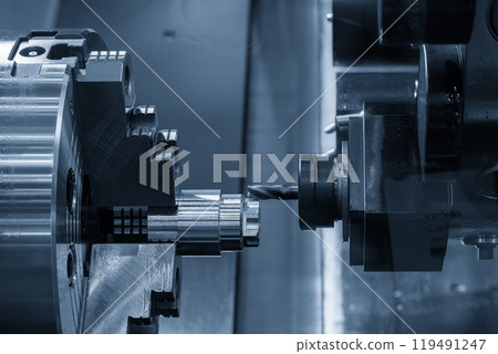 The metal shaft milling process on CNC lathe machine in the light blue scene. 119491247