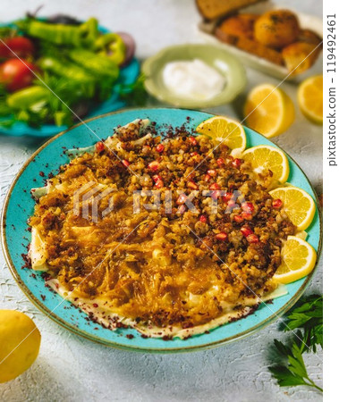 Delicious turkish food kayseri yaglasi corbasi serving on a blue plate 119492461
