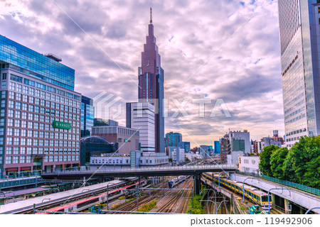 Tokyo cityscape in Japan: NTT Docomo Yoyogi Building, trains, etc. from Shinjuku Station/Shinjuku Takashimaya (Sendagaya, Shibuya Ward) side Tokyo cityscape in Japan: NTT Docomo Yoyogi Building, trains, etc. from Shinjuku Station/Shinjuku Takashimaya (Sendagaya, Shibuya Ward) side 119492906