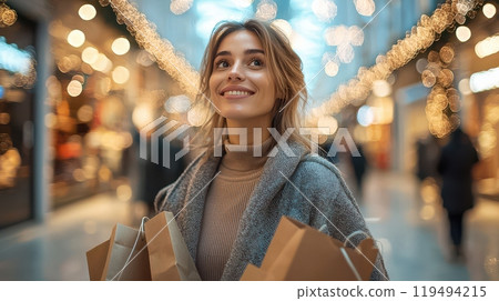 Smiling European woman enjoying a festive shopping experience in a bustling mall filled with colorful lights. Smiling European woman enjoying a festive shopping experience in a bustling mall filled with colorful lights. 119494215