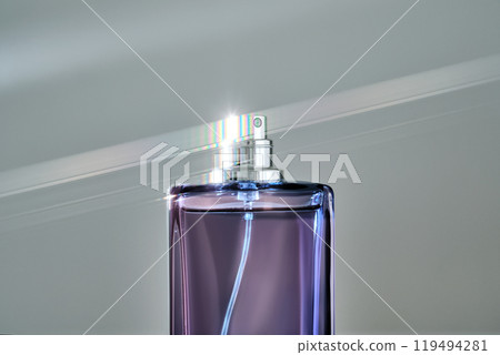 A blue bottle of perfume with a beautiful highlight. A blue bottle of perfume with a beautiful highlight. 119494281