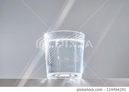 Glass of clean filtered water on white background with beautiful glare. Glass of clean filtered water on white background with beautiful glare. 119494291