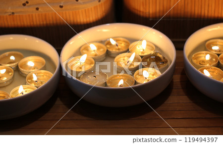 Same Tablet Candles Burns In Round Plates  119494397
