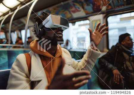 On the subway, a man with VR goggles employs spatial computing to interact with a virtual world 119494826