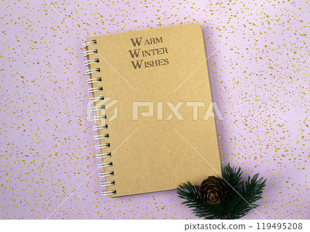 Spiral bound notebook with the words warm winter wishes written on the front Spiral bound notebook with the words warm winter wishes written on the front 119495208