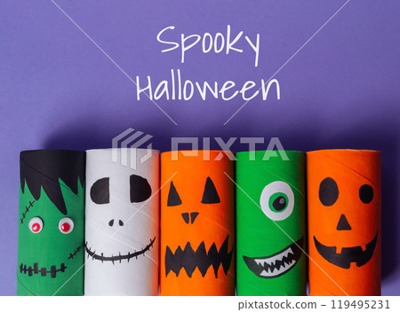 A group of paper tubes with Halloween faces on them A group of paper tubes with Halloween faces on them 119495231