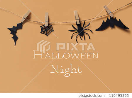Halloween night is a spooky theme with black bats, spiders, and a spider web 119495265