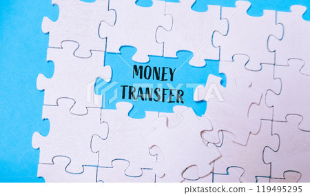 Puzzle pieces with Money transfer text on a blue background 119495295
