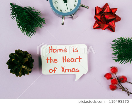 Clock sits on a table with a red bow Clock sits on a table with a red bow 119495370