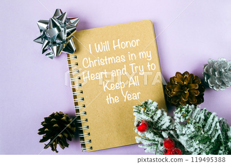 Notebook with a Christmas tree on top of it Notebook with a Christmas tree on top of it 119495388