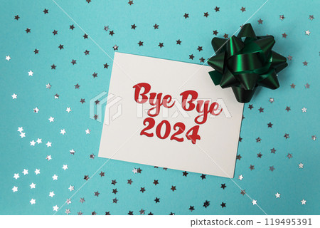 White card with red writing that says bye bye 2024 on it White card with red writing that says bye bye 2024 on it 119495391