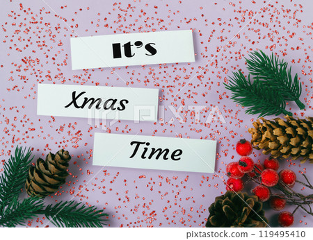 White sign with the words It's Christmas Time written on it White sign with the words It's Christmas Time written on it 119495410