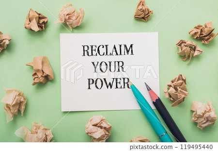 Piece of paper with the words Reclaim Your Power written on it Piece of paper with the words Reclaim Your Power written on it 119495440