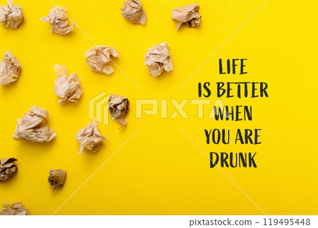 Yellow background with a bunch of crumpled paper on it Yellow background with a bunch of crumpled paper on it 119495448