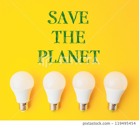 A group of four light bulbs on a yellow background with the words Save the Planet A group of four light bulbs on a yellow background with the words Save the Planet 119495454