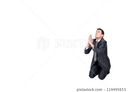 Hopeful man begging for help on knees 119495653